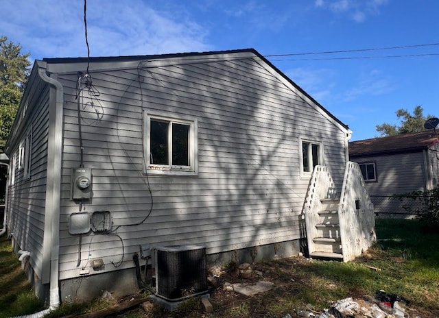 view of side of property featuring cooling unit