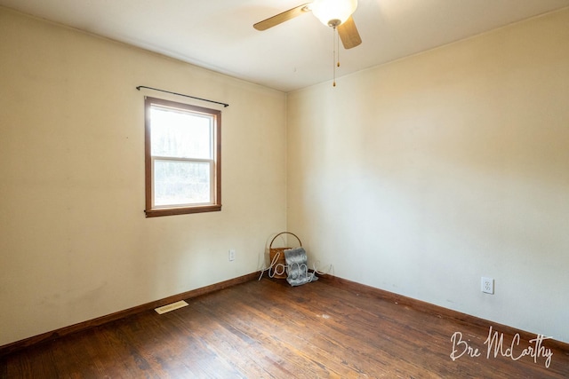 spare room featuring hardwood / wood-style flooring and ceiling fan