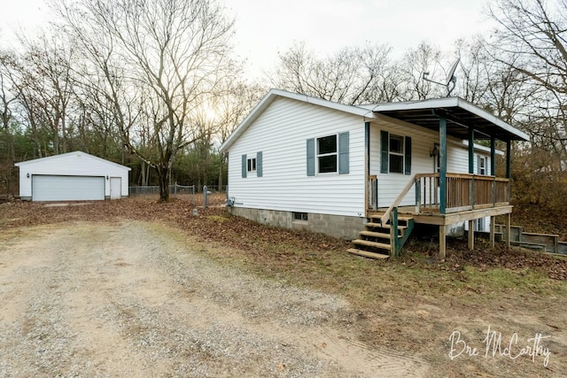 view of front of home with an outdoor structure, a porch, and a garage