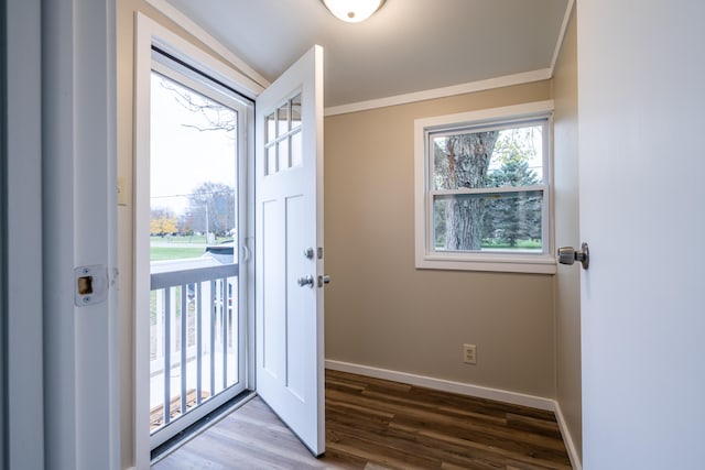 doorway to outside with crown molding and wood-type flooring