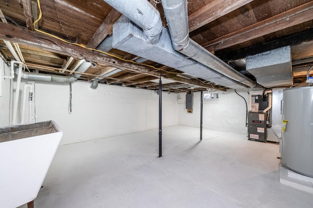 basement with heating unit, electric water heater, electric panel, and sink