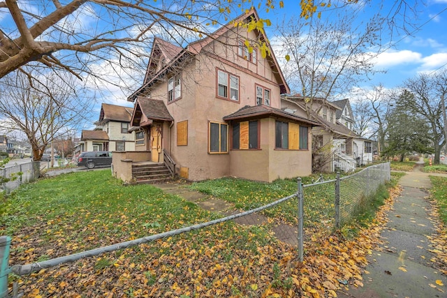 view of home's exterior featuring a yard