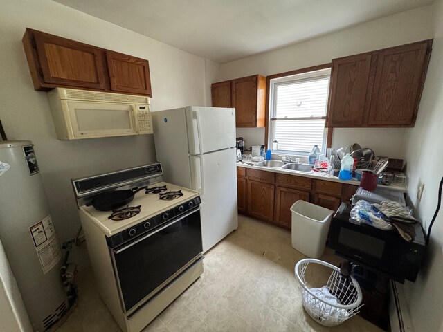 kitchen with gas water heater, white appliances, and sink