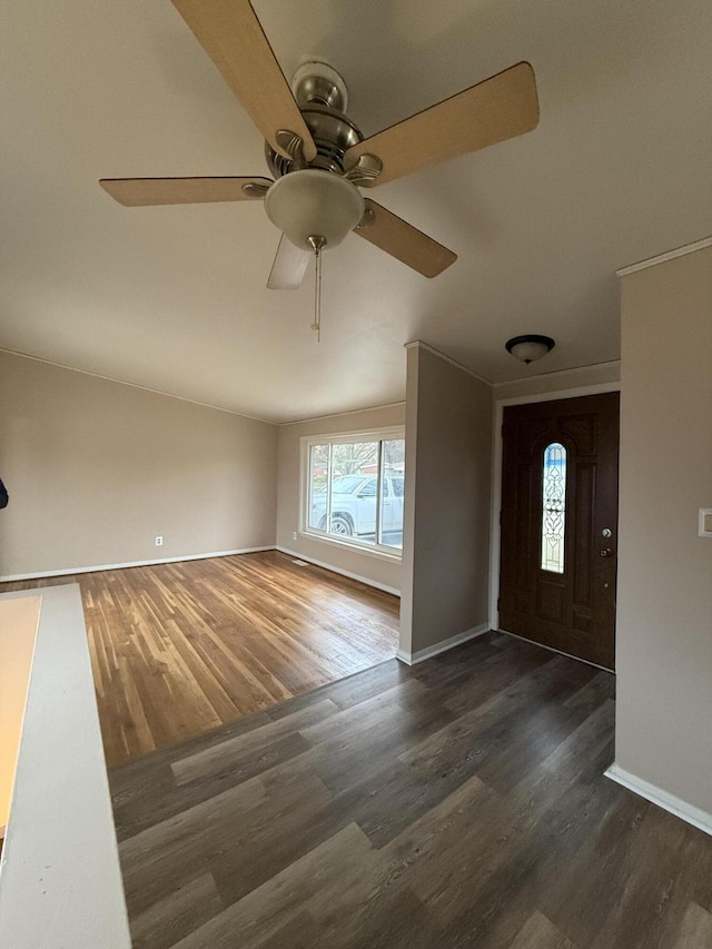 foyer with dark hardwood / wood-style floors and ceiling fan