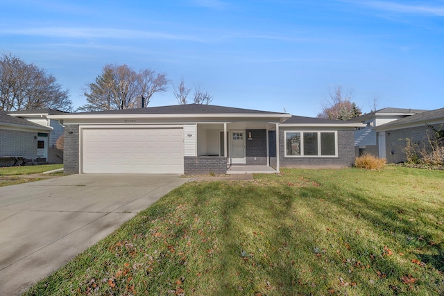 single story home featuring a garage and a front lawn