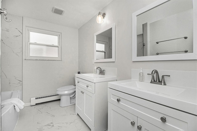 bathroom with vanity, toilet, and baseboard heating