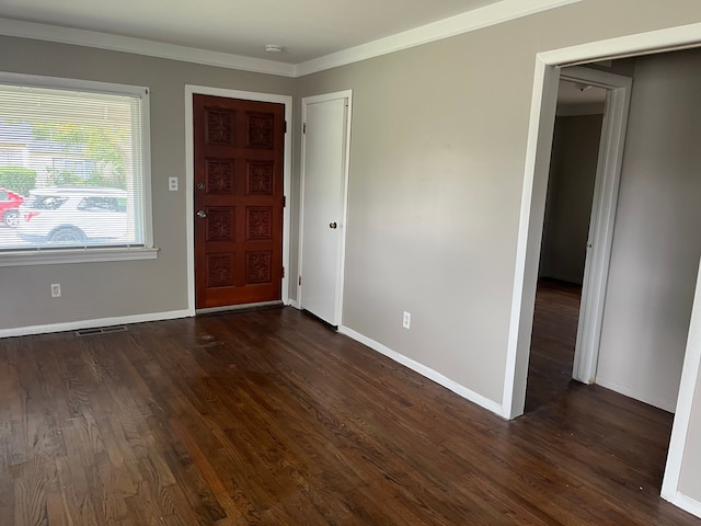 entryway featuring crown molding and dark wood-type flooring