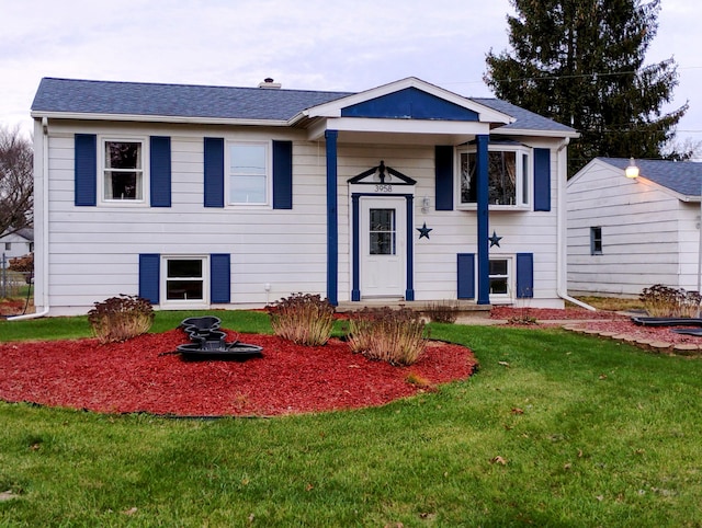 bi-level home with a front yard