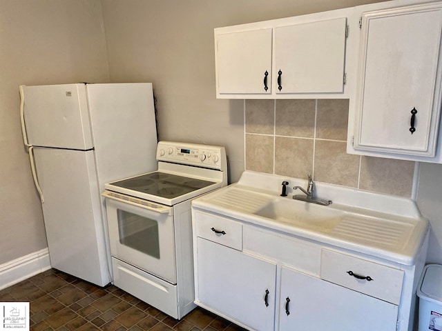 kitchen with backsplash, white cabinetry, and white appliances