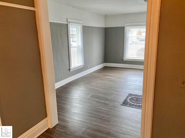 empty room featuring dark wood-type flooring