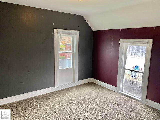 bonus room featuring carpet floors and vaulted ceiling