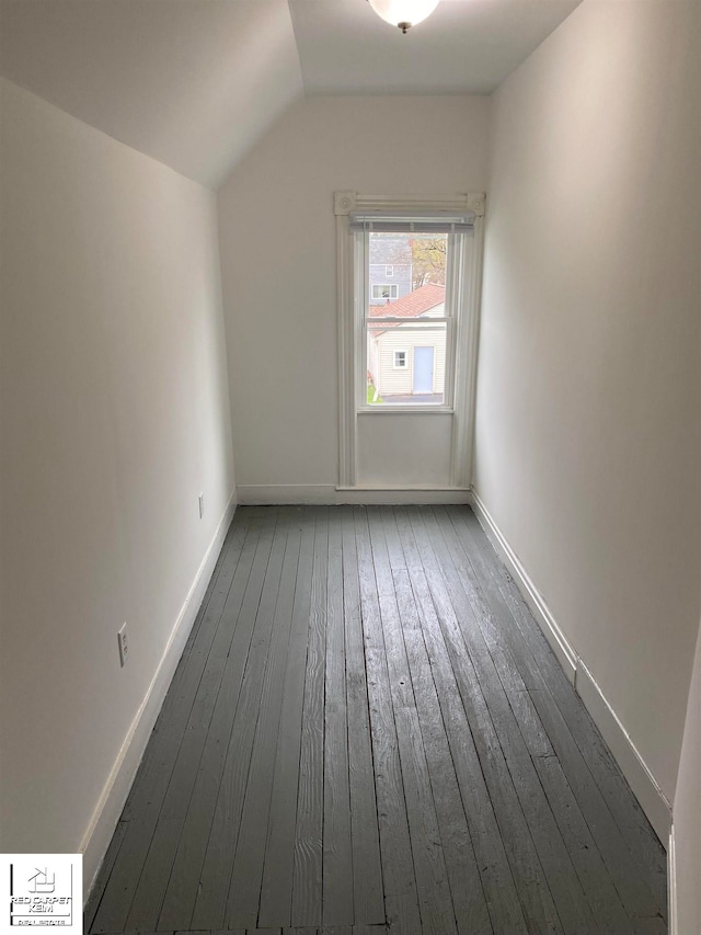 bonus room featuring lofted ceiling and dark hardwood / wood-style floors