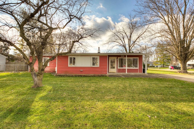 ranch-style home with a front lawn