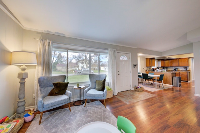 living room with light hardwood / wood-style floors and ornamental molding