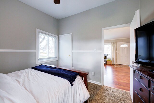 bedroom featuring ceiling fan and light hardwood / wood-style flooring