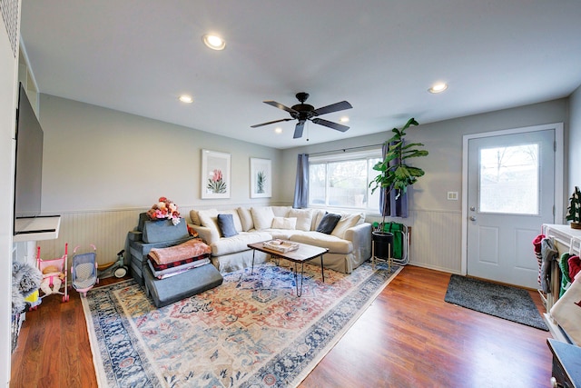 living room with ceiling fan, plenty of natural light, and hardwood / wood-style floors