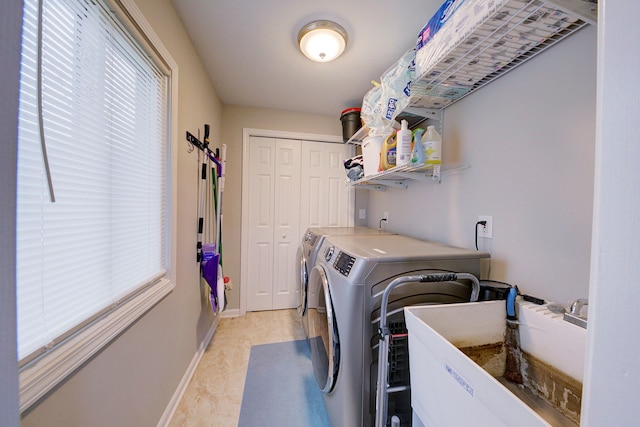 laundry room with washing machine and dryer and sink