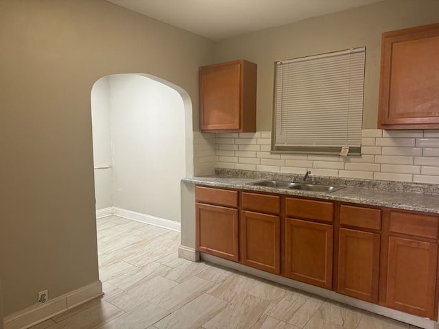 kitchen with decorative backsplash and sink