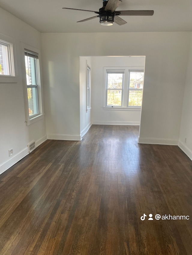 unfurnished room featuring ceiling fan and dark hardwood / wood-style floors