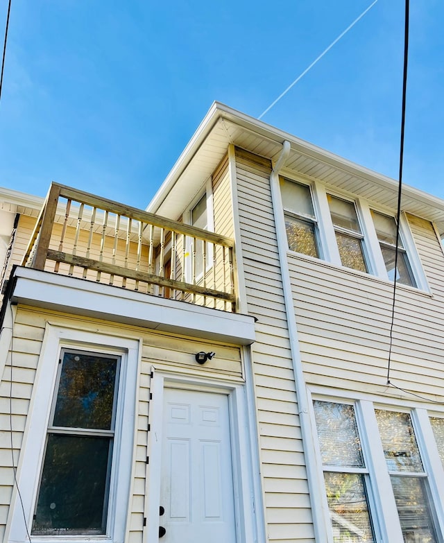 view of home's exterior featuring a balcony