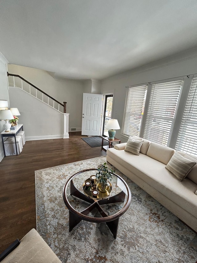 living room featuring dark hardwood / wood-style flooring