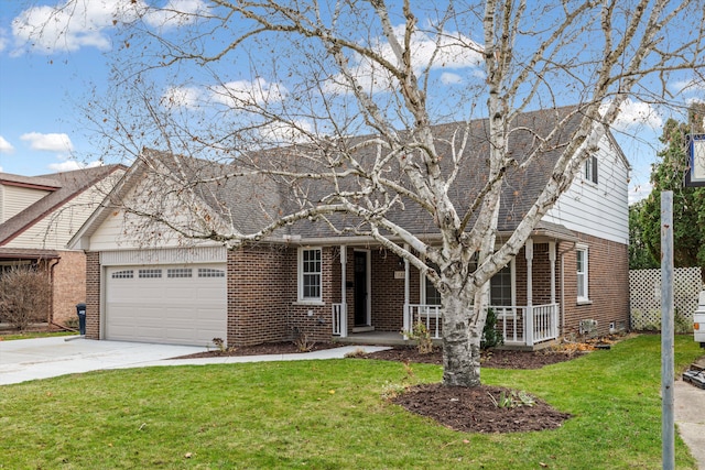 view of front facade featuring a porch, a garage, and a front lawn