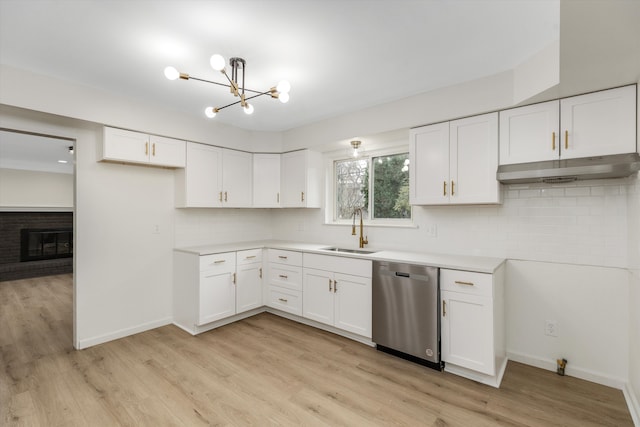 kitchen with dishwasher, white cabinets, light hardwood / wood-style floors, and sink