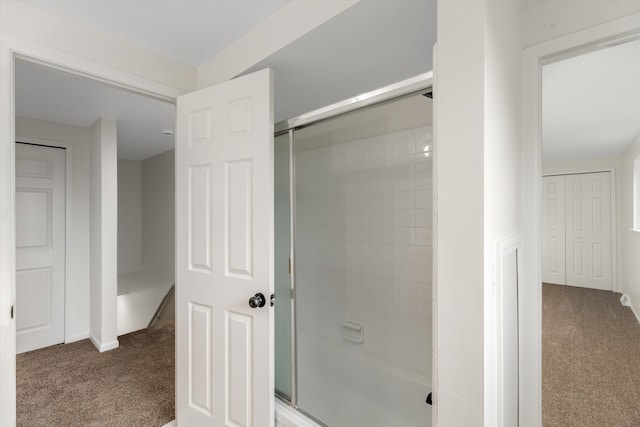 bathroom featuring bath / shower combo with glass door