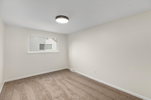 unfurnished room featuring carpet floors