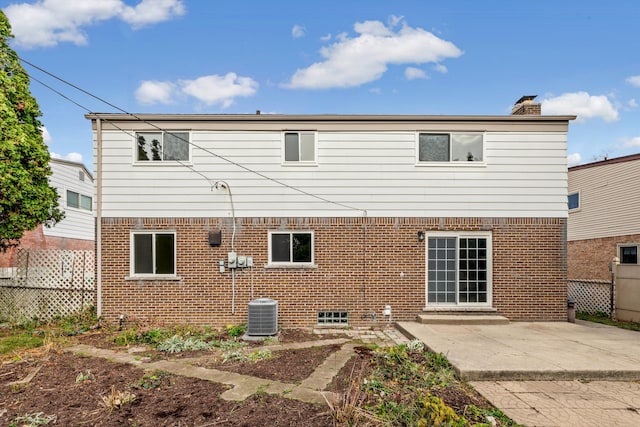 back of house featuring cooling unit and a patio area