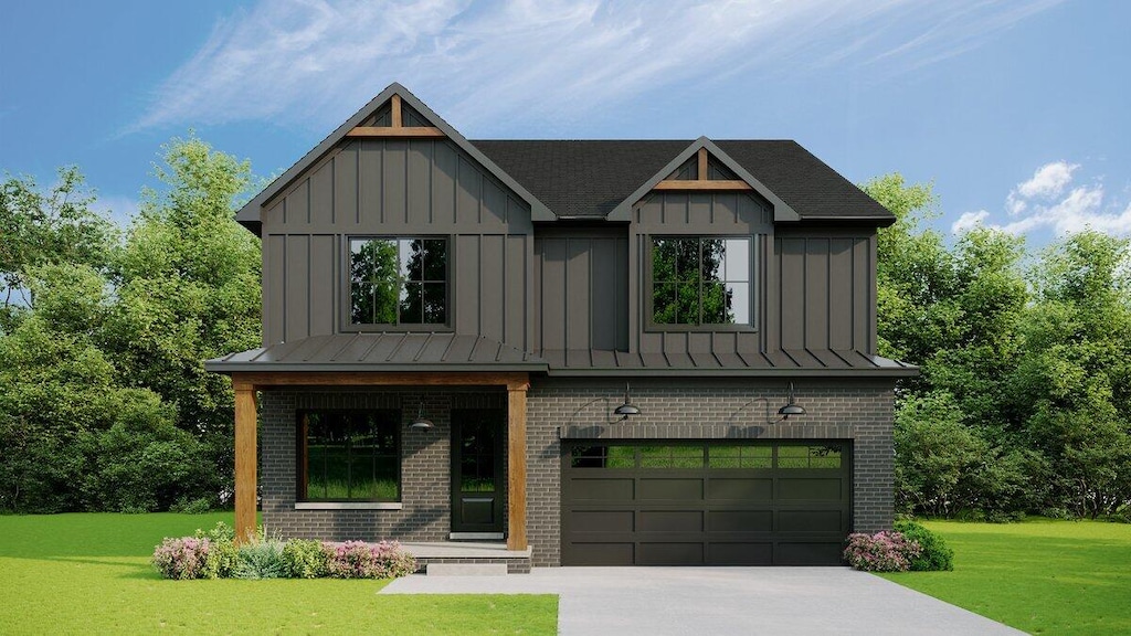 view of front of property featuring a garage and a front yard