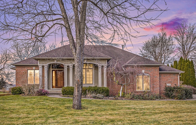 view of front of property with a yard