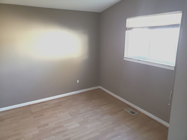 unfurnished room featuring light hardwood / wood-style flooring