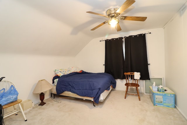 carpeted bedroom with ceiling fan and vaulted ceiling