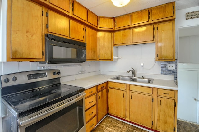 kitchen featuring sink, tasteful backsplash, and stainless steel electric range