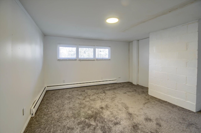 empty room with carpet floors and a baseboard heating unit