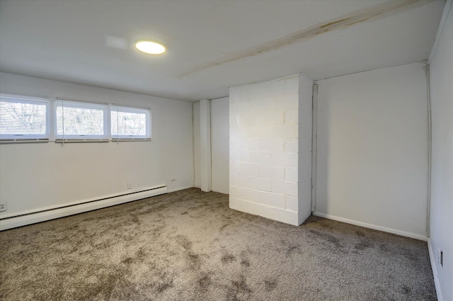 interior space featuring carpet flooring and a baseboard heating unit