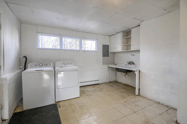 laundry room featuring independent washer and dryer, electric panel, sink, and a baseboard heating unit