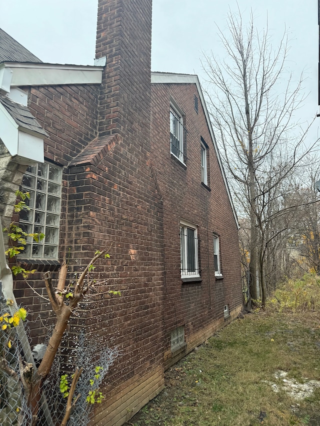 view of home's exterior with a yard