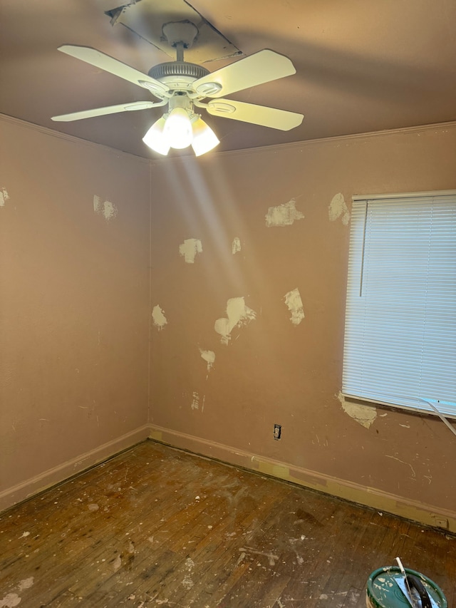 spare room featuring hardwood / wood-style floors and ceiling fan