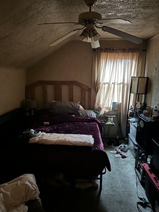 carpeted bedroom featuring a textured ceiling, vaulted ceiling, and ceiling fan