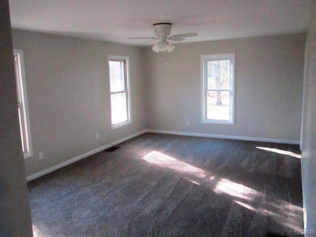 carpeted empty room featuring ceiling fan