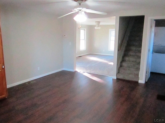 spare room with ceiling fan and dark hardwood / wood-style flooring