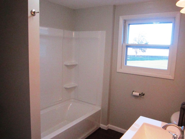 full bathroom with shower / tub combination, sink, and toilet