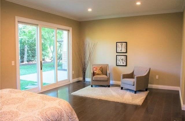 bedroom with ornamental molding, dark wood-type flooring, and access to outside