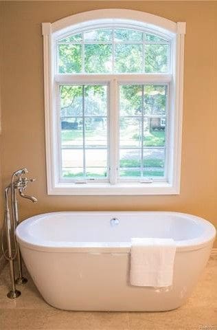 bathroom featuring tile patterned floors and a bathing tub