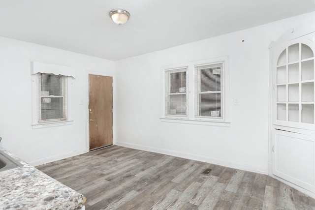 unfurnished room featuring light wood-type flooring