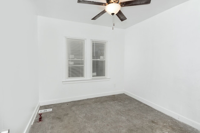 carpeted spare room with ceiling fan