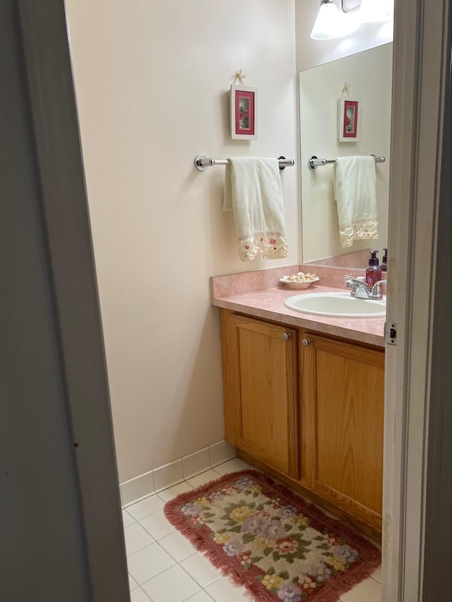 bathroom with tile patterned flooring and vanity