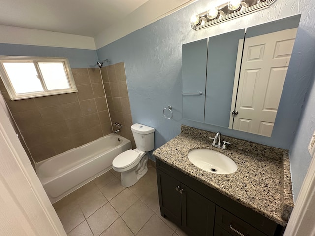 full bathroom with toilet, vanity, tiled shower / bath combo, and tile patterned floors